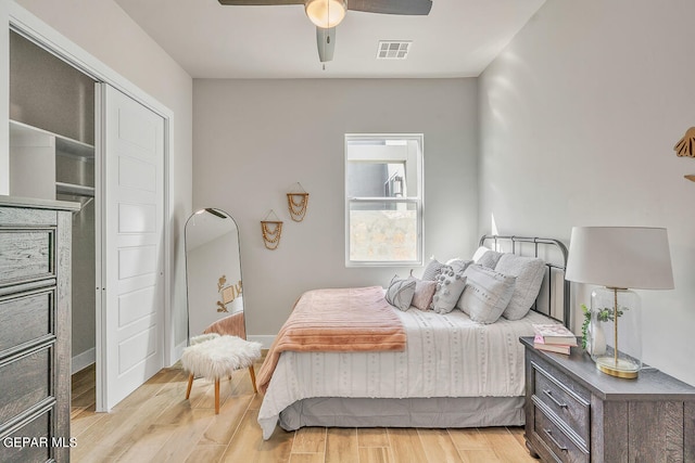 bedroom featuring a closet, ceiling fan, and light wood-type flooring