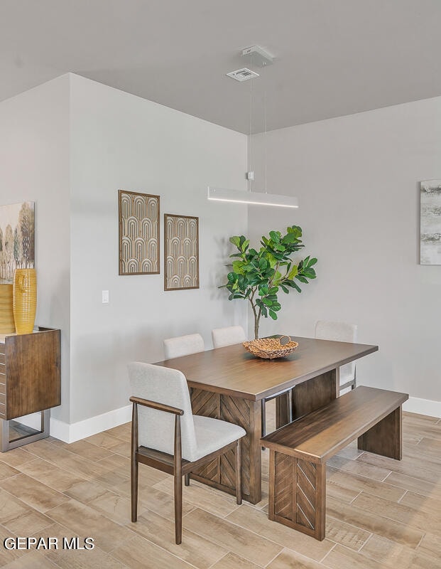 dining area featuring light wood-type flooring