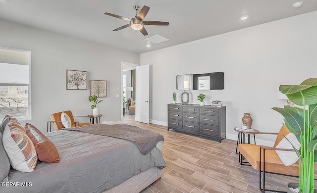 bedroom with light wood-type flooring and ceiling fan