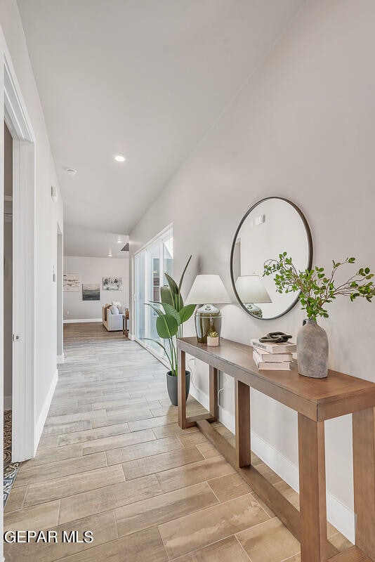 hall with light wood-type flooring