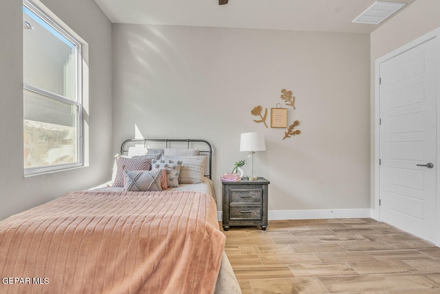 bedroom with light hardwood / wood-style floors