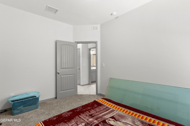 bedroom with light colored carpet