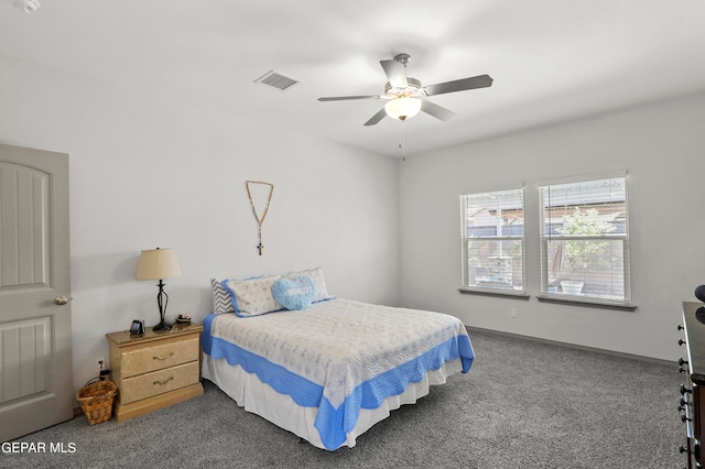 bedroom featuring ceiling fan and dark colored carpet