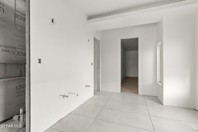 corridor featuring light tile patterned floors