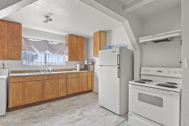 kitchen featuring wall chimney range hood, washer / clothes dryer, white appliances, sink, and light tile floors