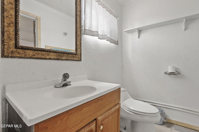 bathroom with tile flooring, toilet, and oversized vanity