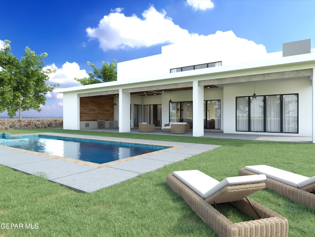 view of pool with ceiling fan and a yard