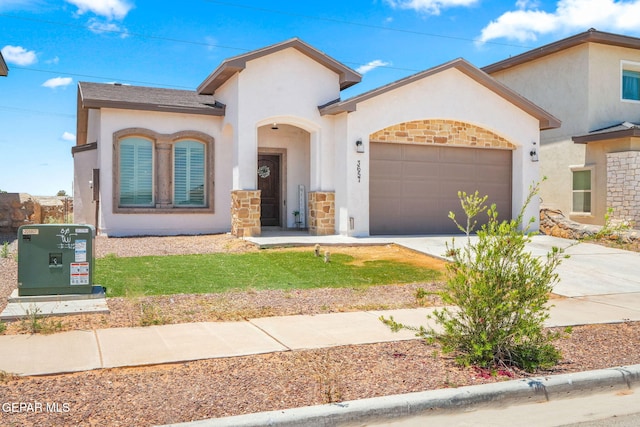 mediterranean / spanish-style home with a garage