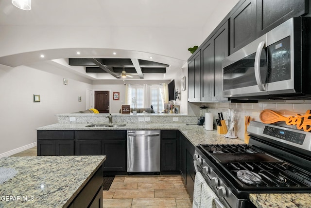 kitchen featuring light stone countertops, sink, coffered ceiling, beamed ceiling, and appliances with stainless steel finishes