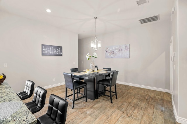 dining room with a notable chandelier