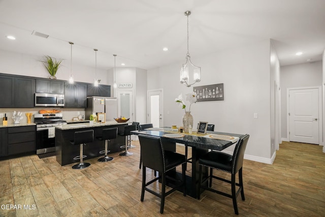 dining space featuring a chandelier