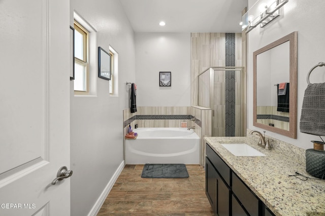 bathroom with plus walk in shower and vanity