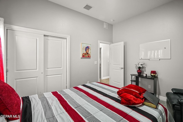 carpeted bedroom with a closet