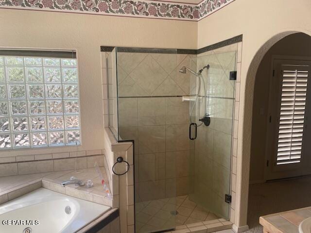 bathroom with independent shower and bath