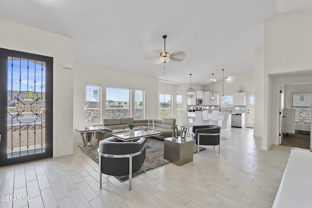 265 Adamtowne Dr, El Paso, TX 79928 - living area with ceiling fan, light wood-style flooring, and high vaulted ceiling