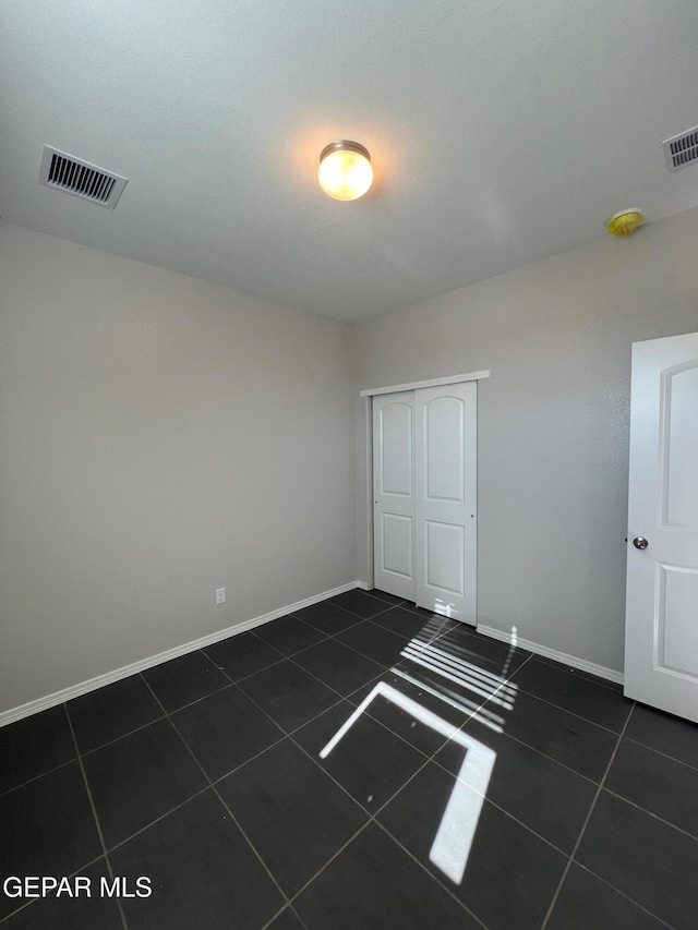 view of tiled spare room