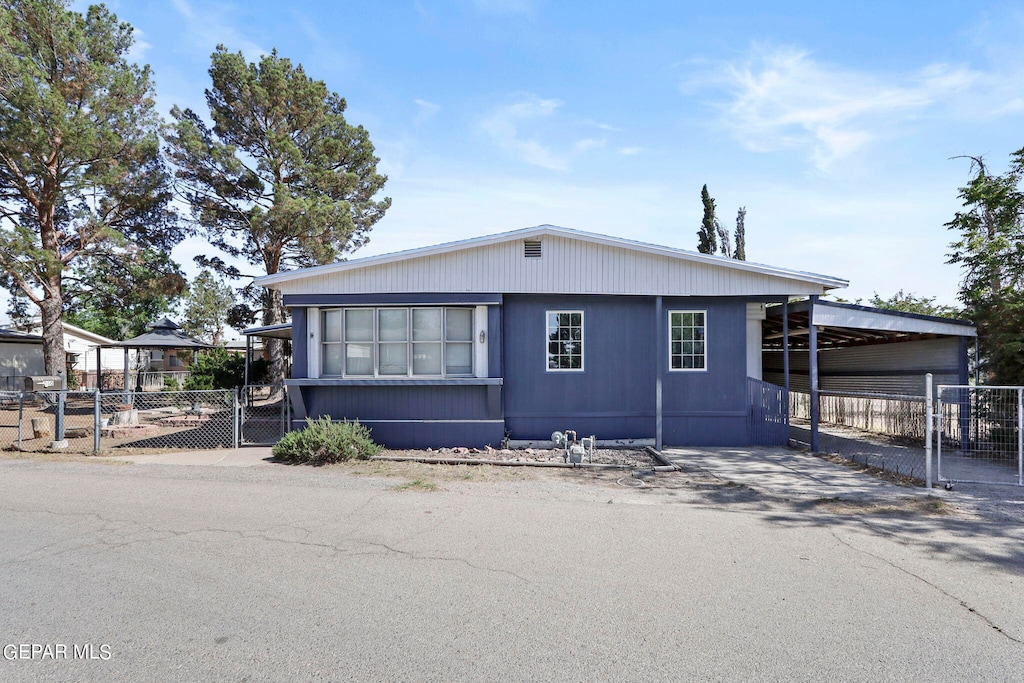 manufactured / mobile home with a carport