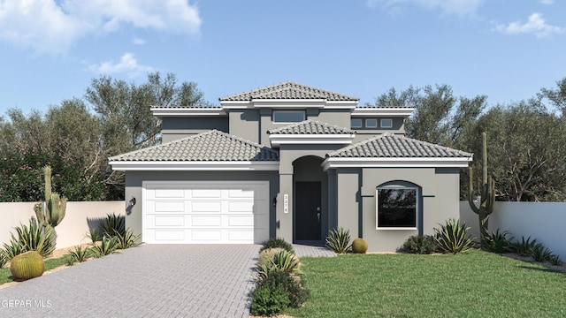 mediterranean / spanish house featuring a garage and a front yard