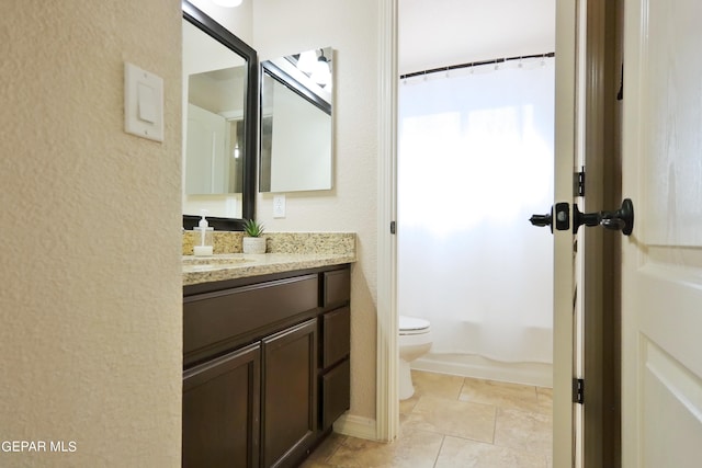 full bathroom with shower / bath combo, vanity, toilet, and tile patterned floors