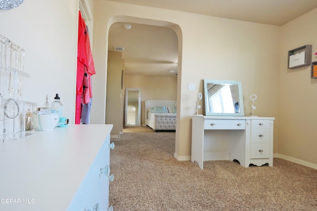 unfurnished bedroom featuring light carpet