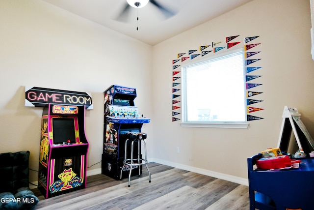 playroom with hardwood / wood-style floors and ceiling fan