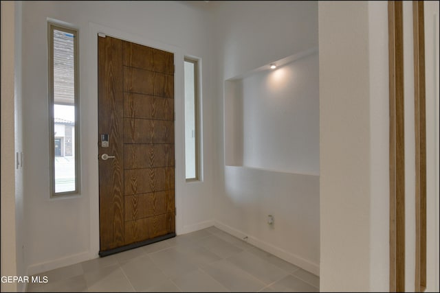 entrance foyer featuring light tile patterned floors