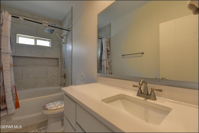 full bathroom featuring vanity, shower / bathtub combination with curtain, and toilet