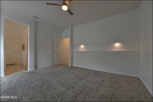 empty room with light carpet and ceiling fan