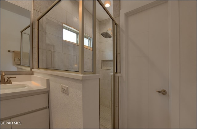 bathroom featuring vanity and walk in shower