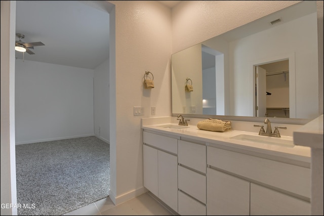 bathroom featuring vanity and ceiling fan