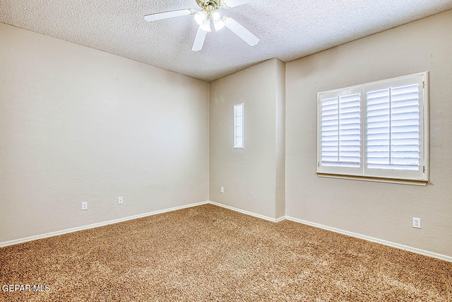 unfurnished room featuring a healthy amount of sunlight, a textured ceiling, and carpet floors