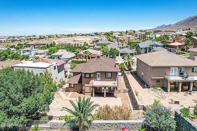 birds eye view of property with a mountain view