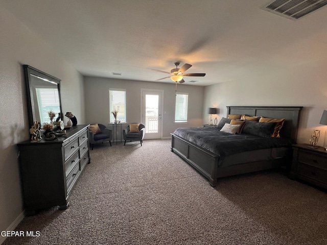 bedroom featuring access to exterior, visible vents, dark carpet, and ceiling fan