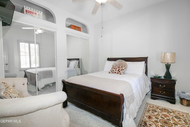 bedroom with ceiling fan and light colored carpet