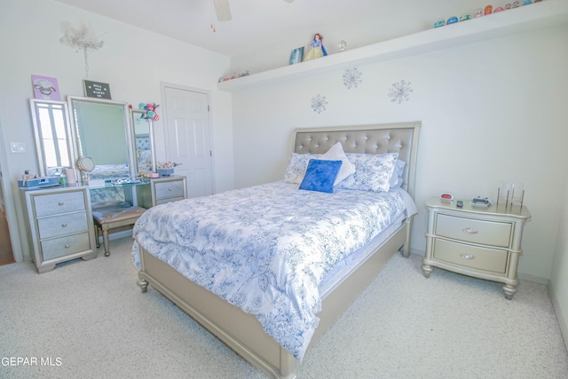 bedroom featuring ceiling fan and light carpet