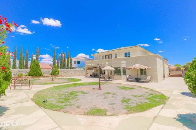 back of property featuring a patio area