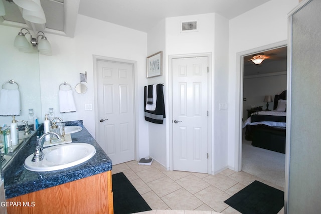 bathroom featuring tile patterned flooring and vanity