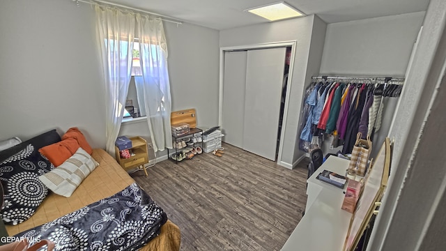 bedroom featuring hardwood / wood-style flooring and a closet