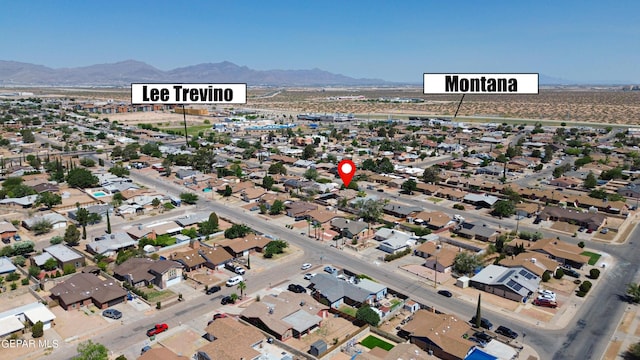 drone / aerial view featuring a mountain view