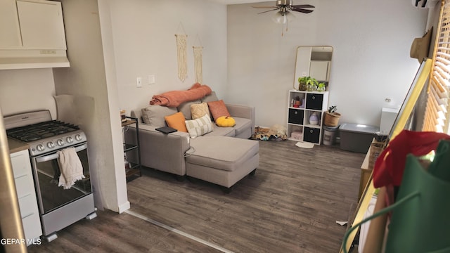 living room with ceiling fan and dark hardwood / wood-style floors