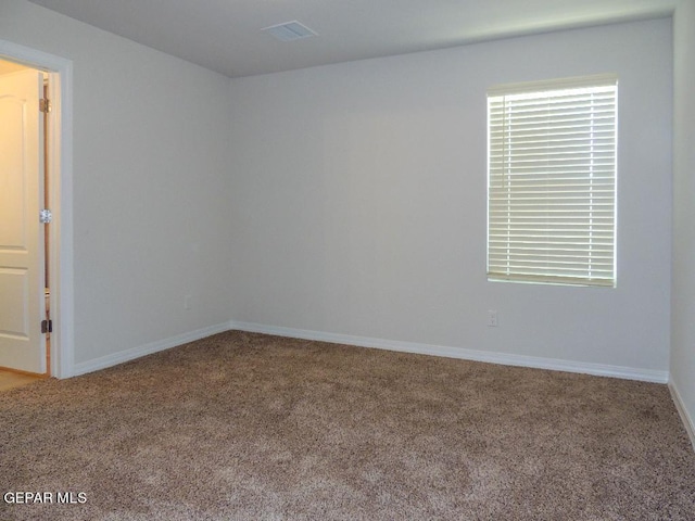 empty room with carpet flooring