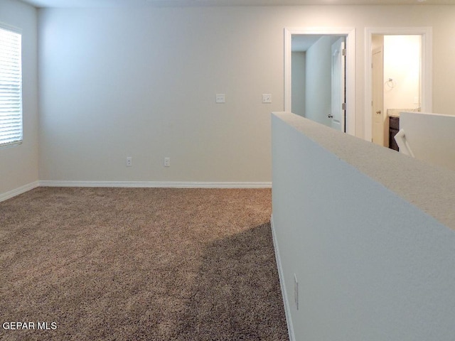 unfurnished room with carpet