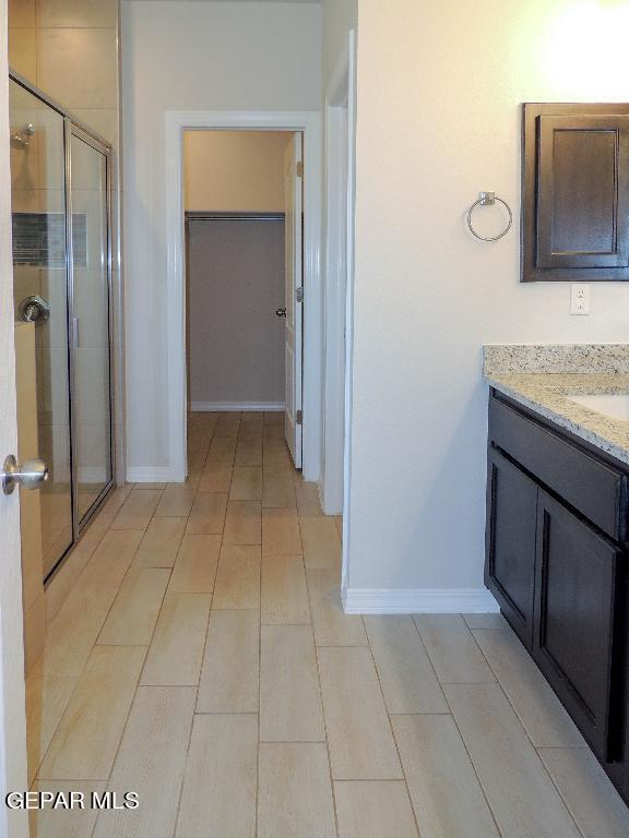 bathroom with vanity and an enclosed shower