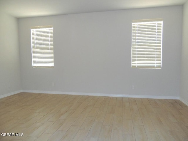 unfurnished room featuring light wood-type flooring