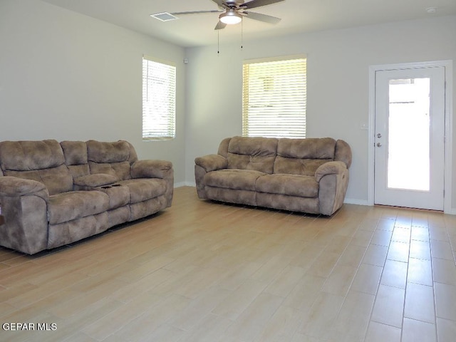 living room featuring ceiling fan