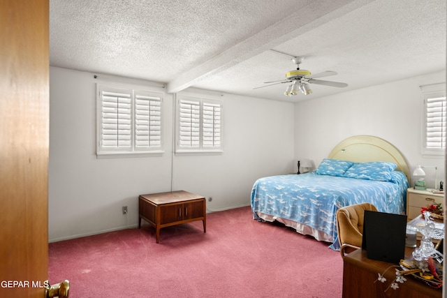 carpeted bedroom with multiple windows, a ceiling fan, and a textured ceiling