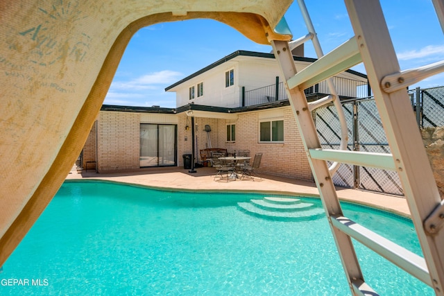 pool featuring a patio area