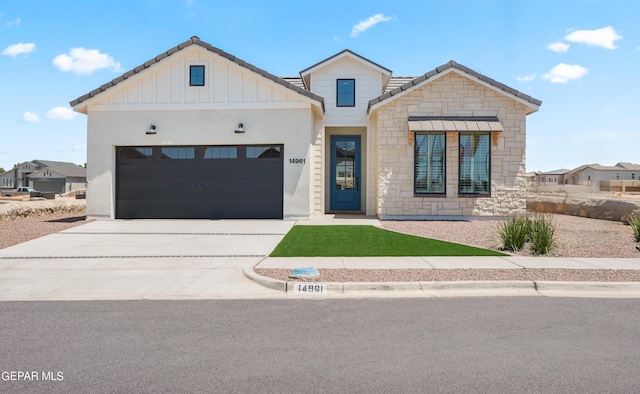 modern farmhouse style home featuring a garage