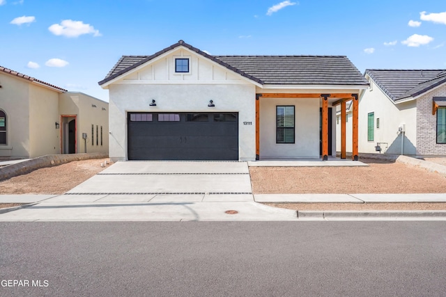 modern inspired farmhouse with a garage