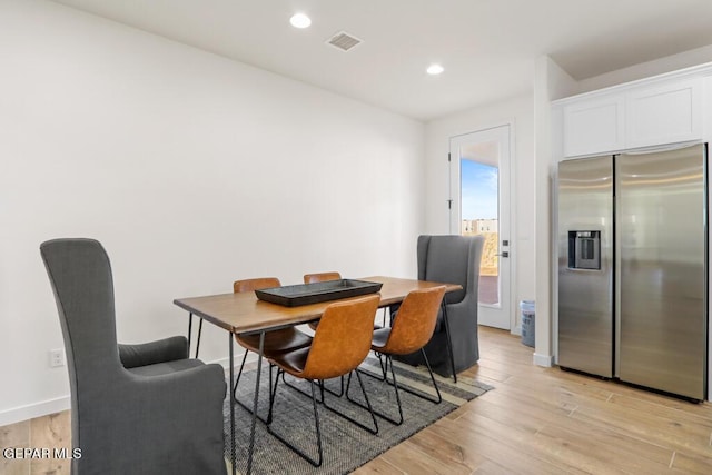 dining room with light wood-type flooring